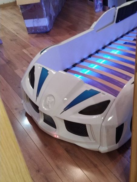 Ліжко машинка Audi біла з підсвічуванням, дверцятами, що відкриваються, звуковими ефектами і пультом 200.01.03 фото